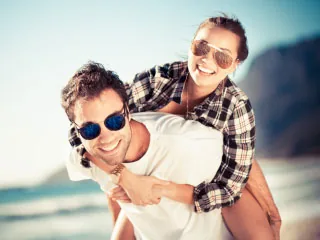 Happy couple outdoors in sunglasses